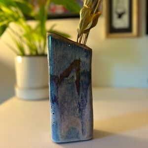 Beautiful glazed pottery vase with asymmetrical shape and blue earthtones